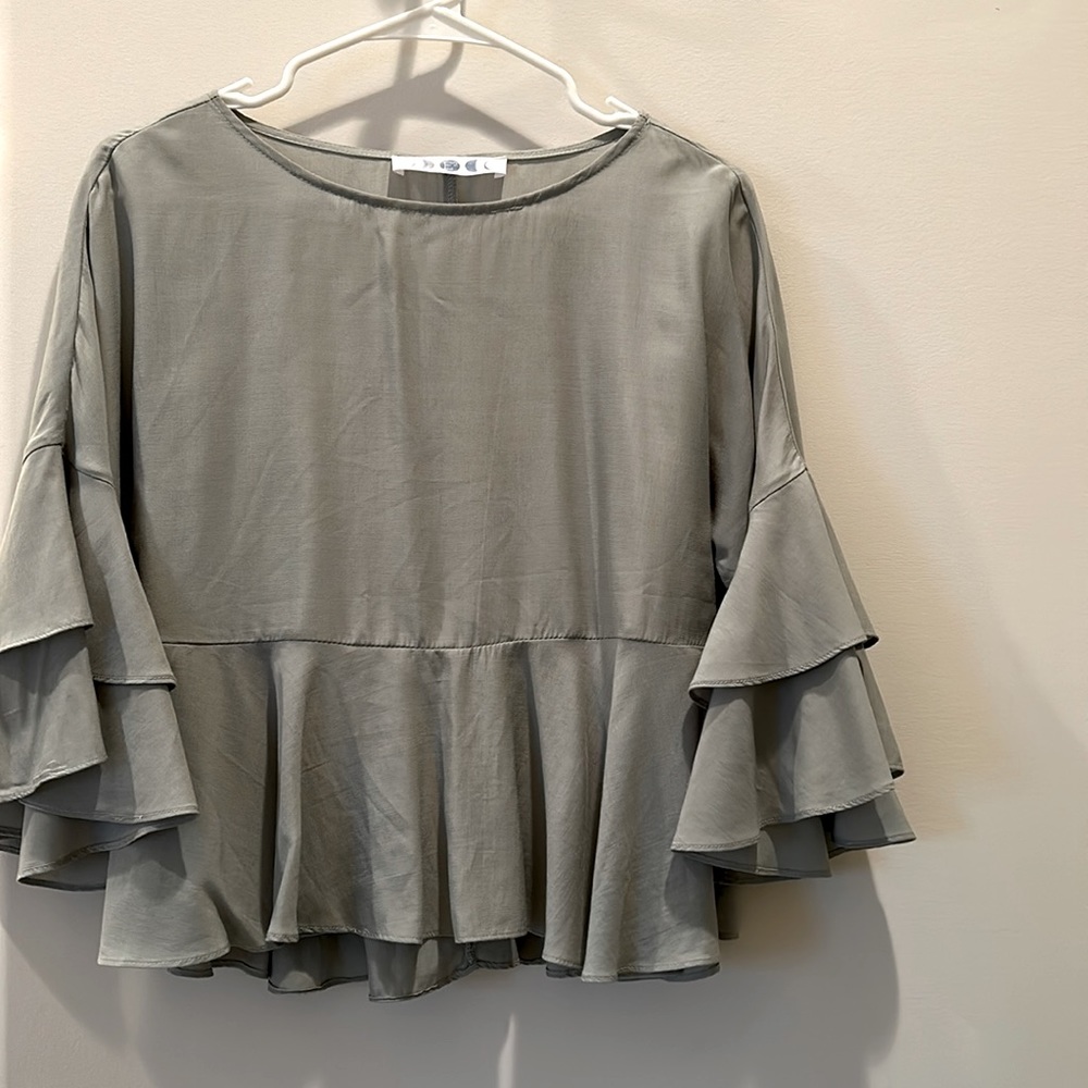 Light green blouse with bell sleeves